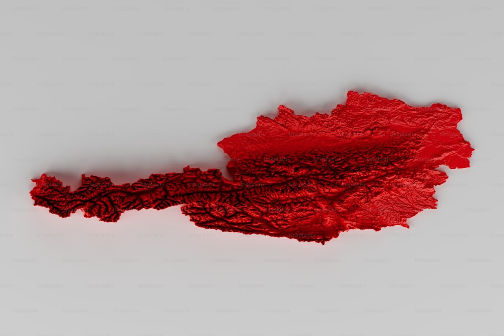 une feuille de papier rouge sur une surface blanche