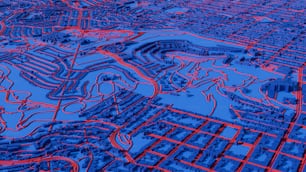 an aerial view of a city in blue and red