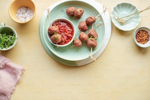 a plate with meatballs and sauce on it