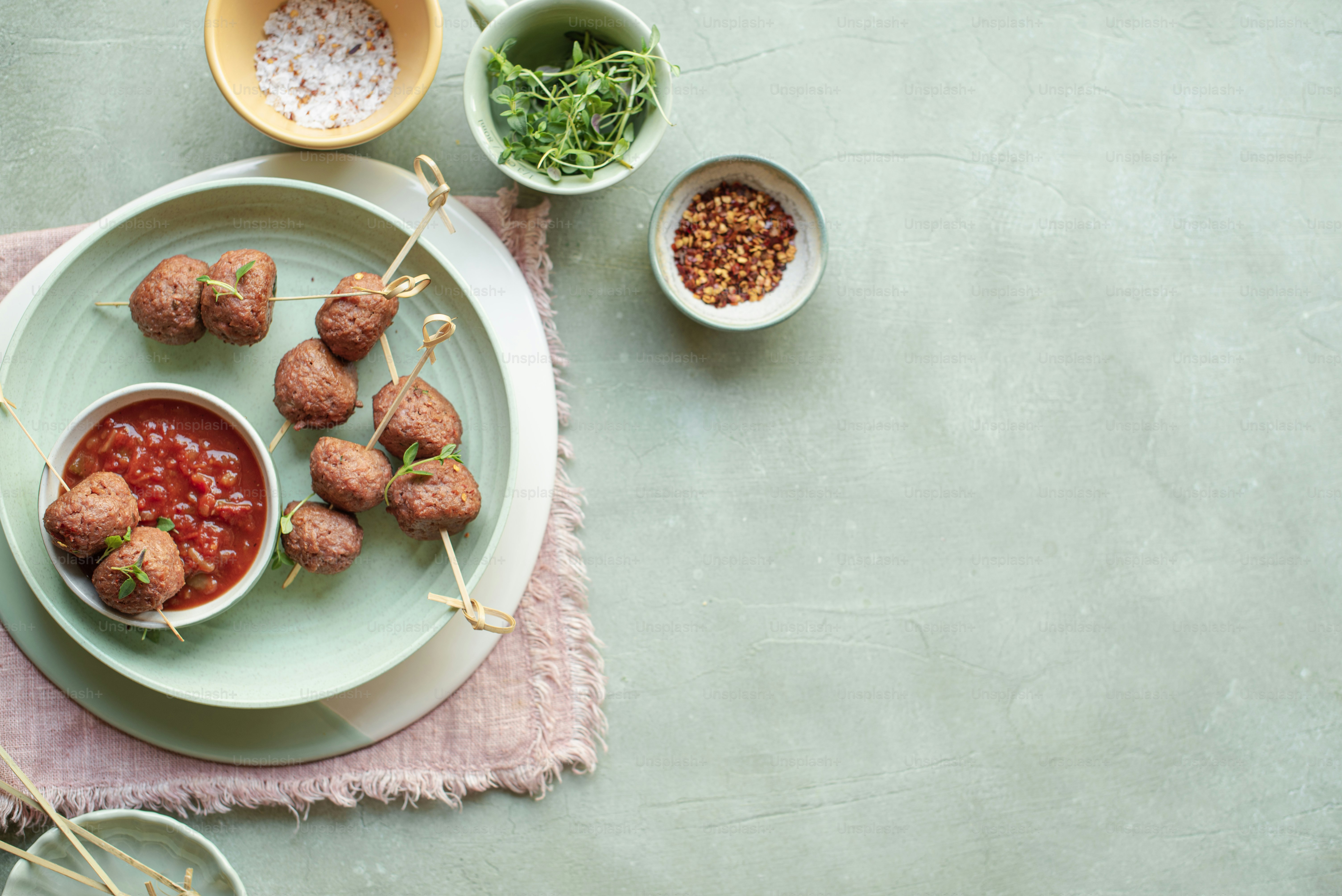A plate with meatballs and sauce on it photo – Vegan meatballs Image on ...