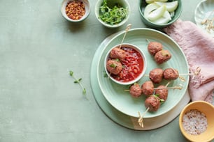 a plate with meatballs and sauce on it