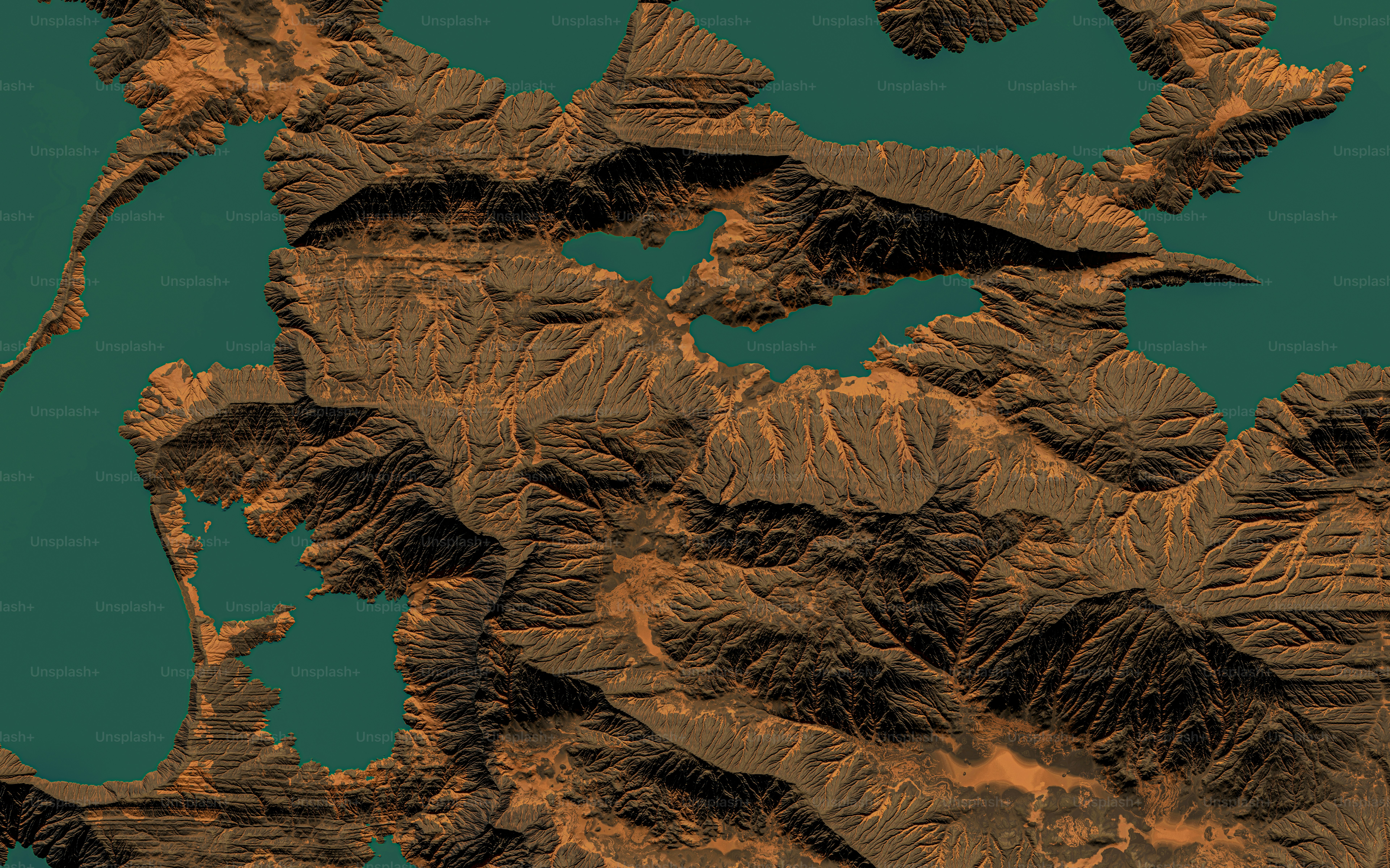 a map of a mountain range with a blue sky in the background
