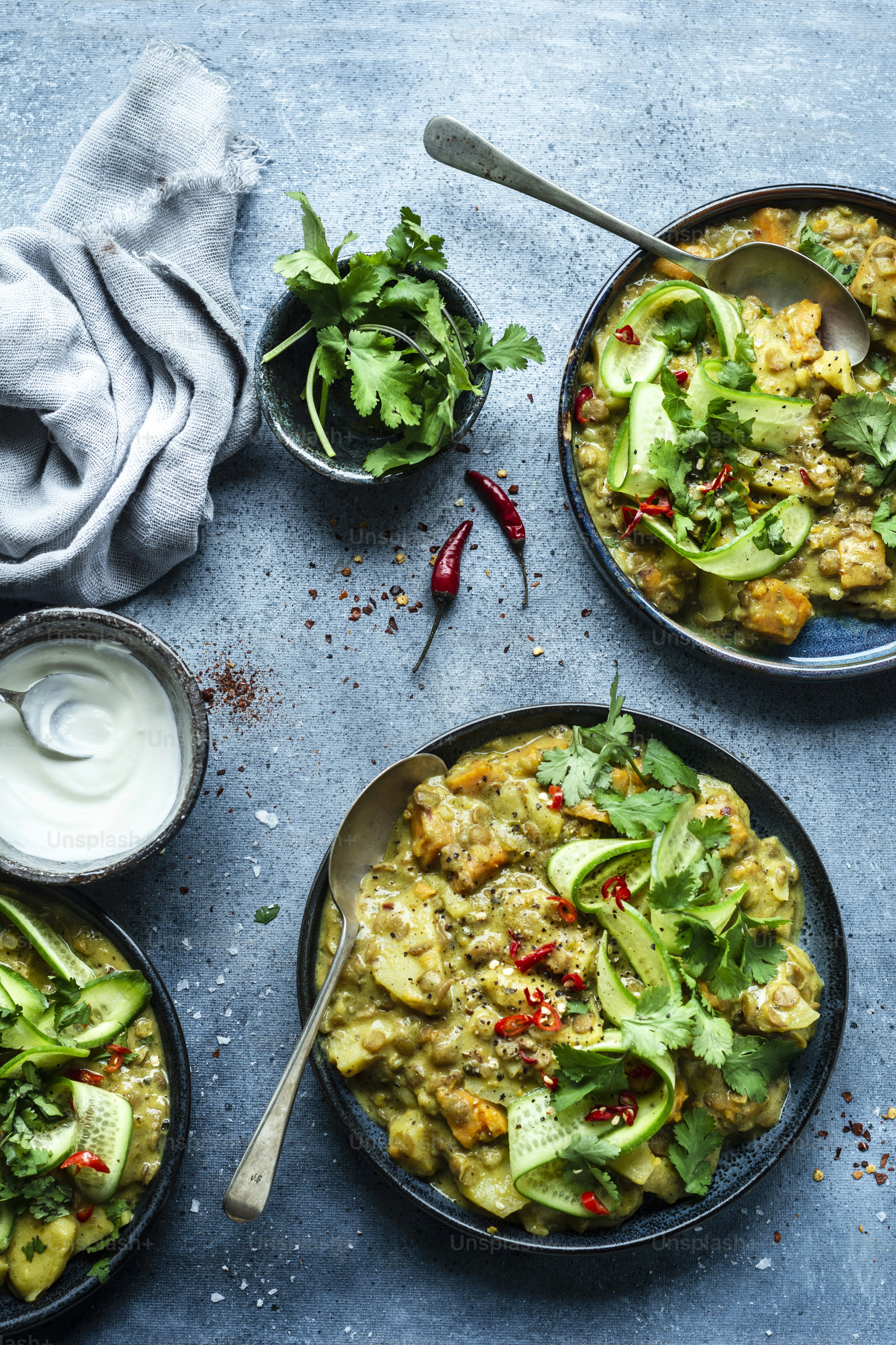 a table topped with bowls filled with food
