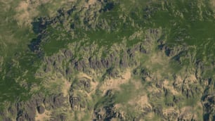 an aerial view of a green mountain range