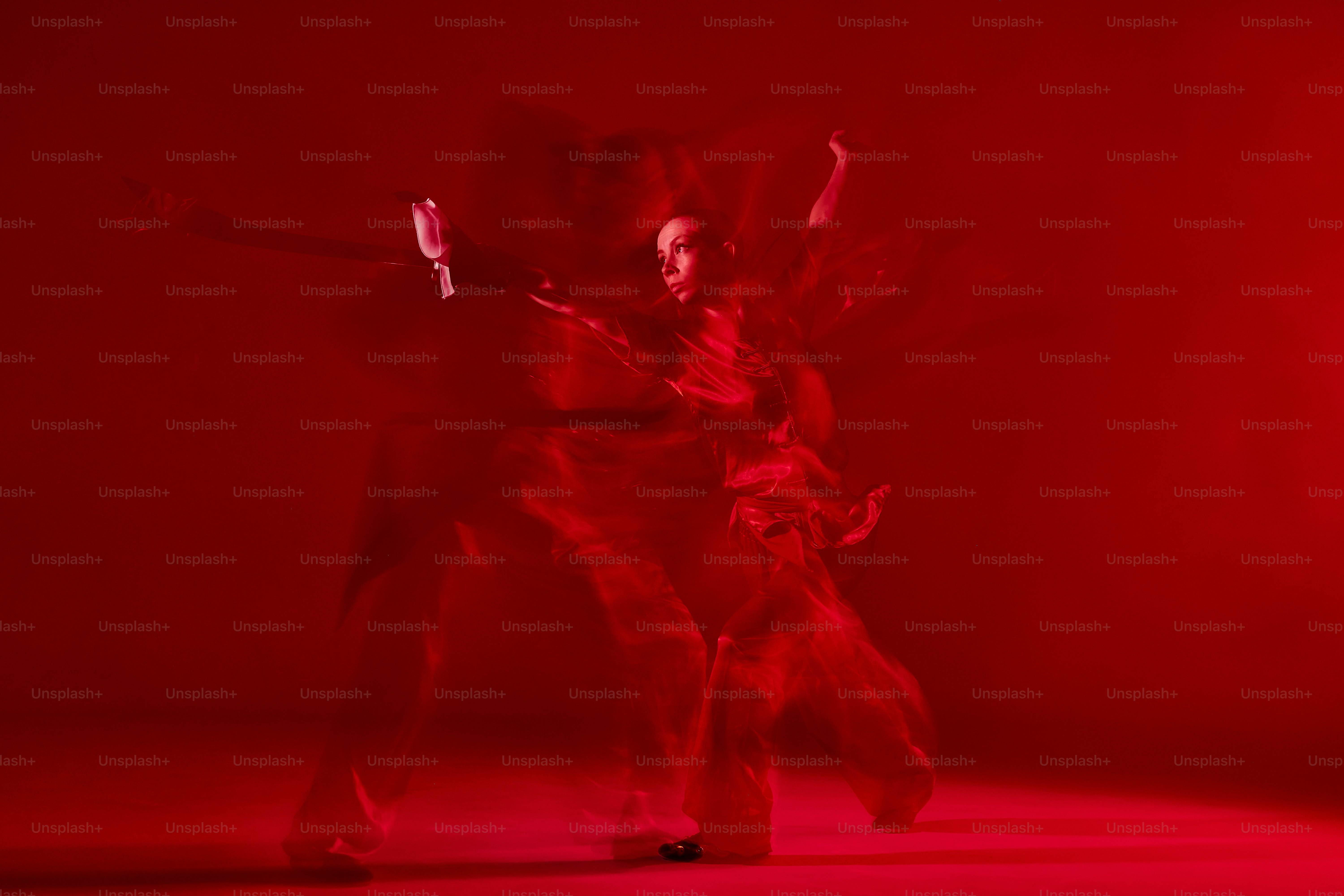 a couple of people that are dancing in the dark