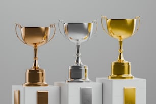 a group of three trophies sitting on top of each other