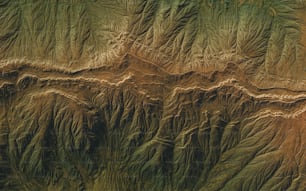 an aerial view of the terrain of a mountain range