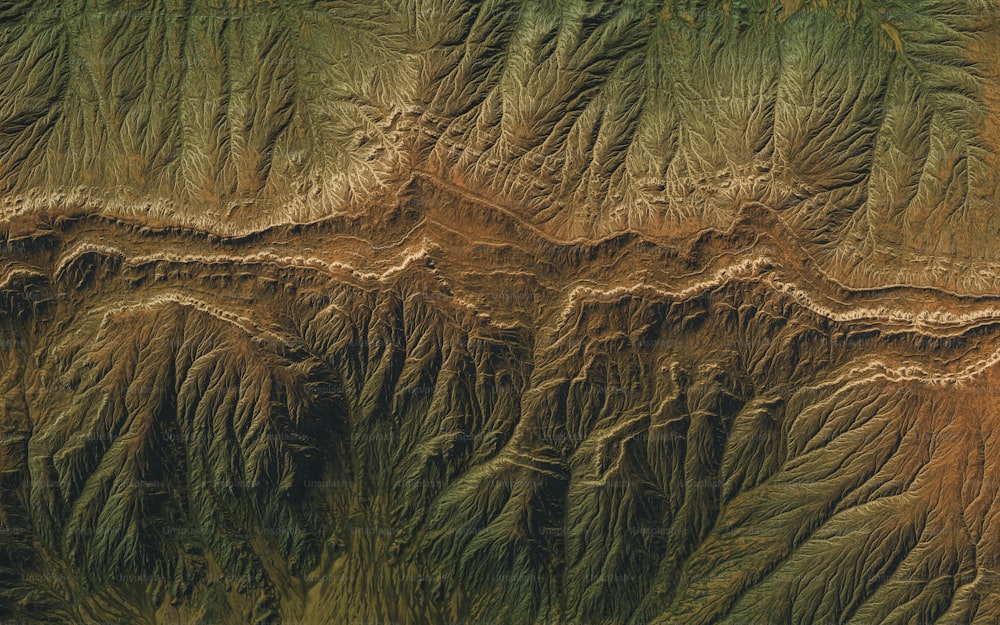 an aerial view of the terrain of a mountain range
