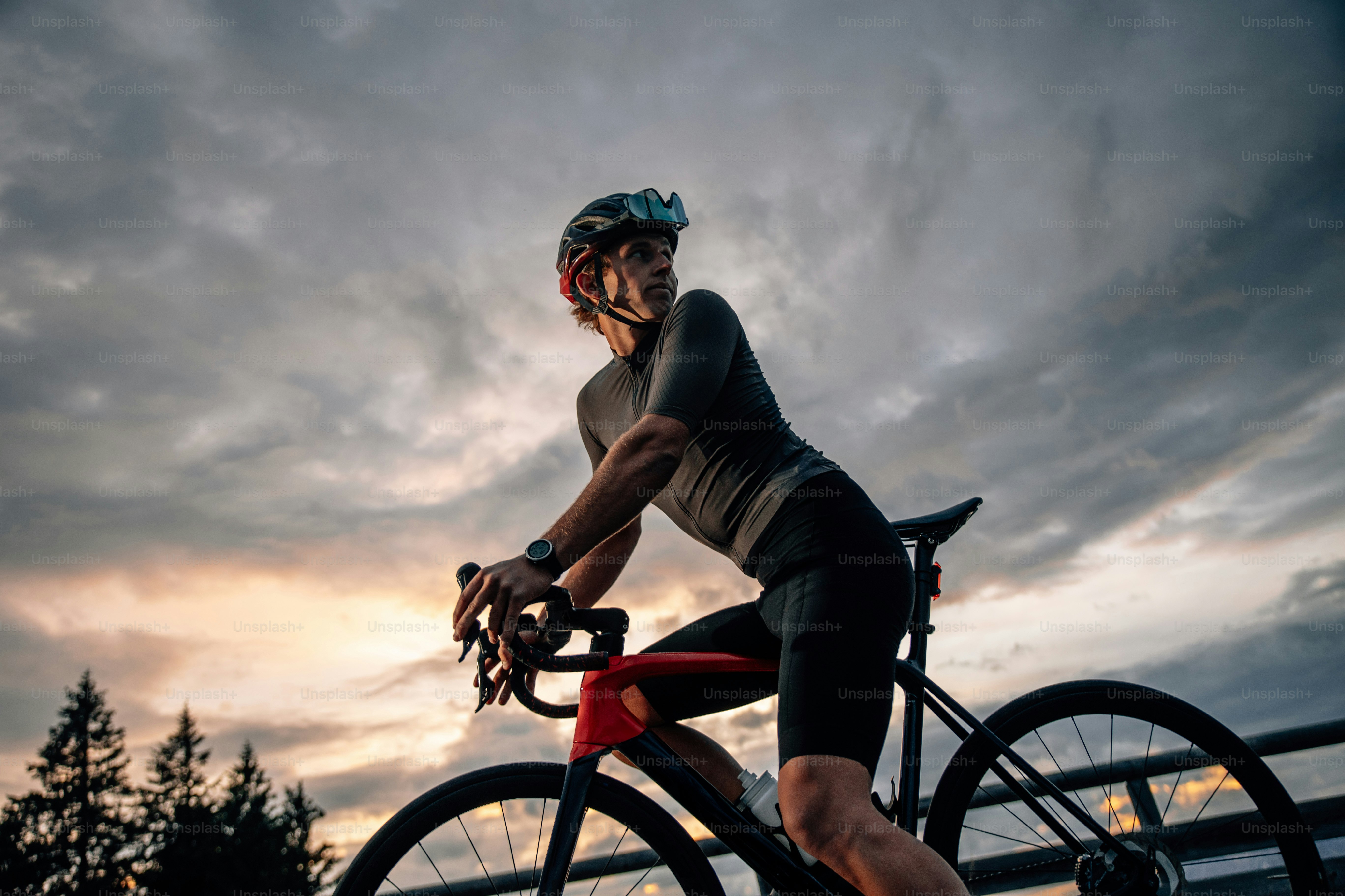 a person riding a bike on a cloudy day