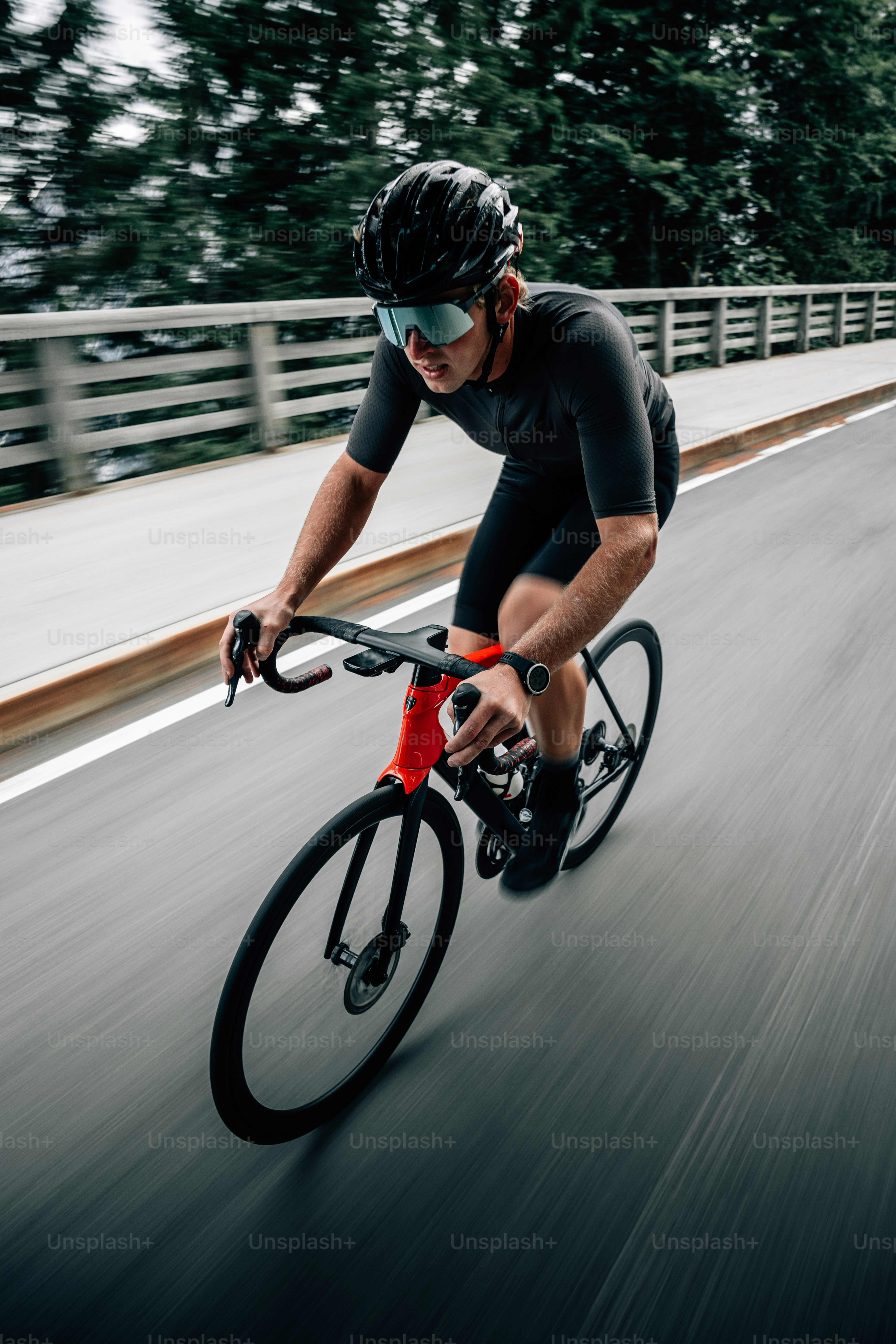 a man riding a bike down a street