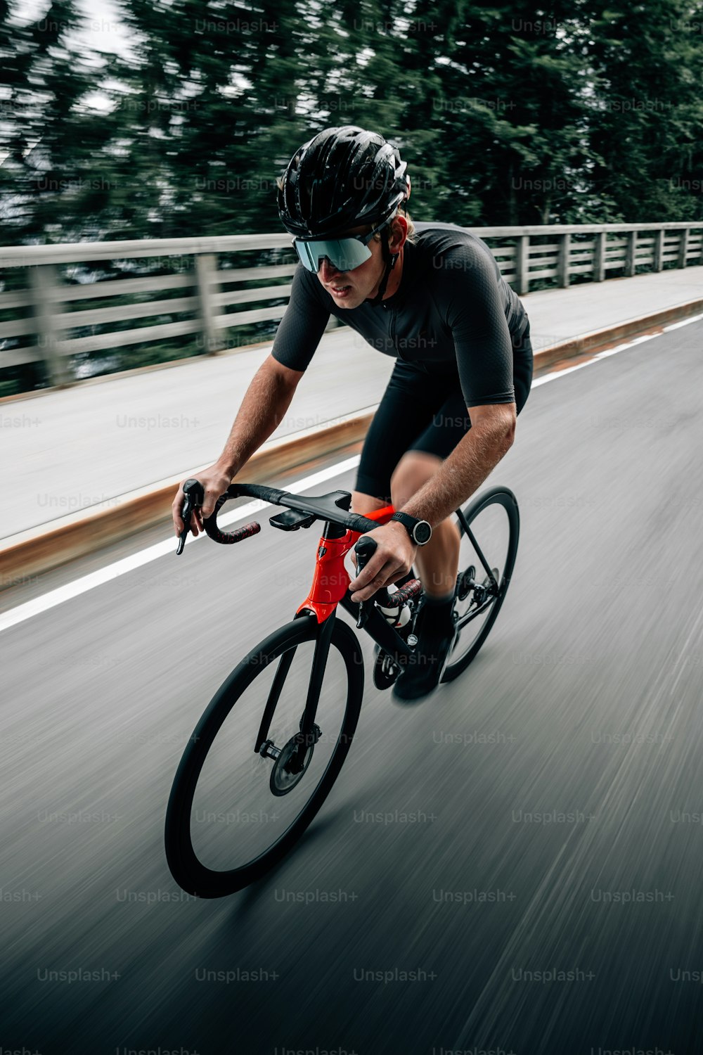 a man riding a bike down a street