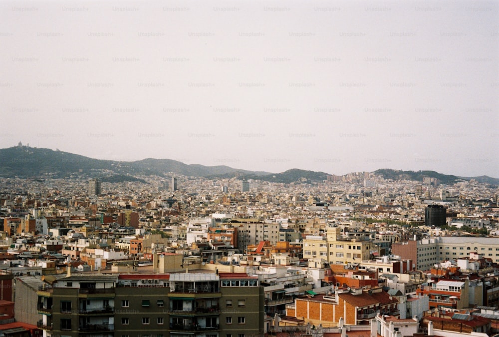 a view of a city with mountains in the background