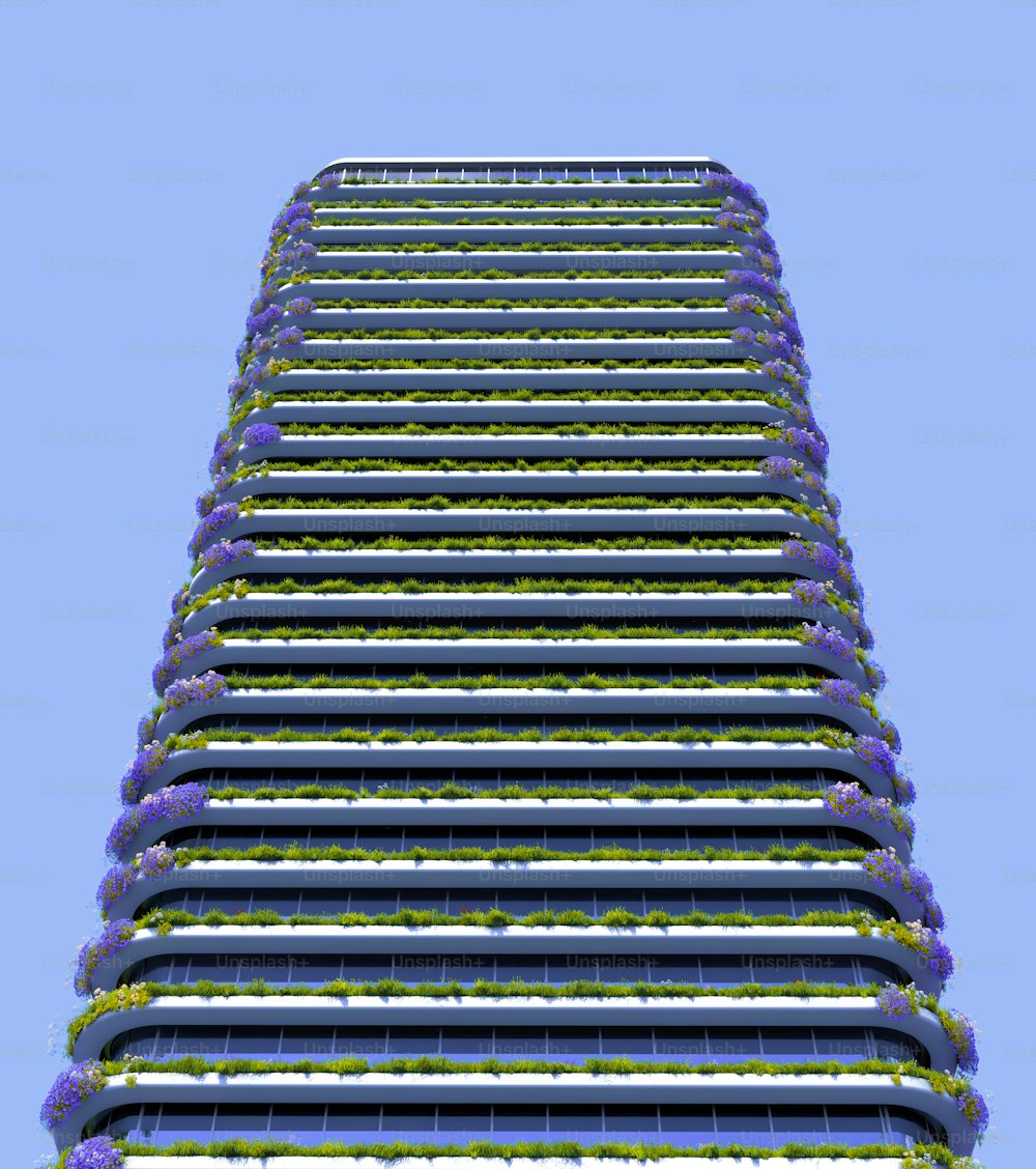 a very tall building with a bunch of flowers on it