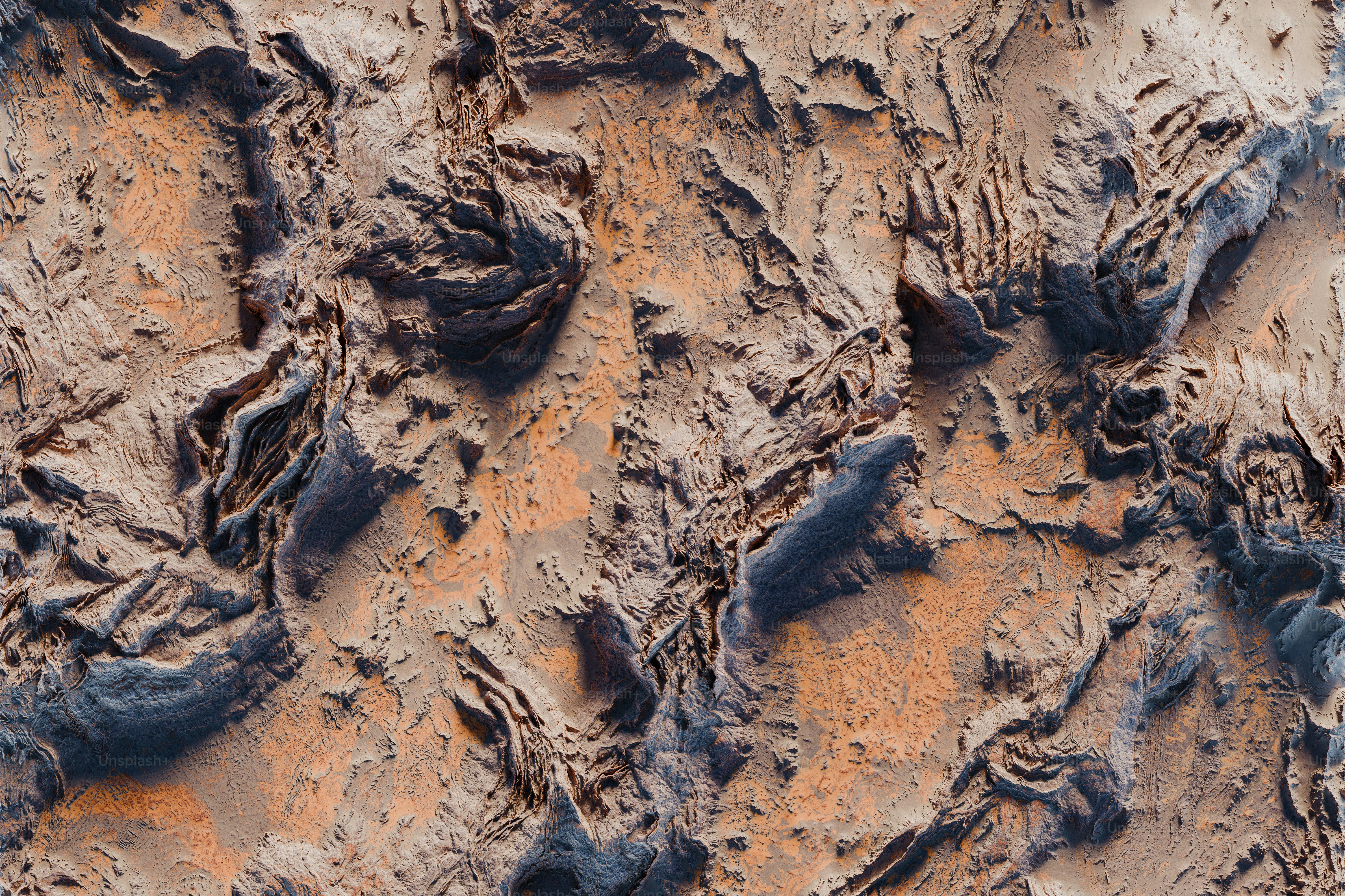 a close up of a dirt surface with rocks
