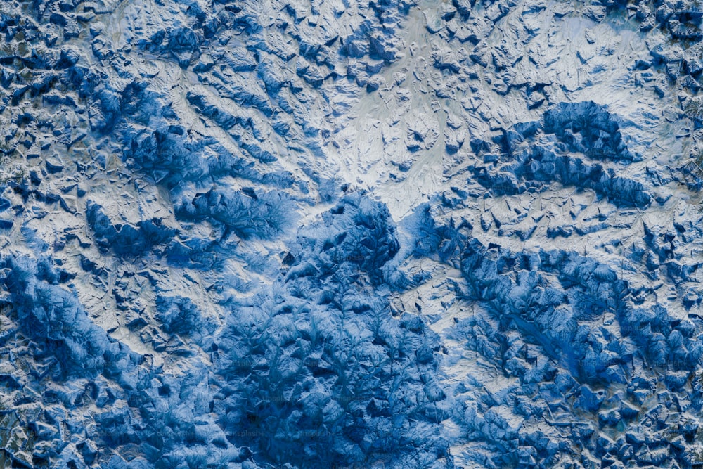 an aerial view of a snow covered mountain