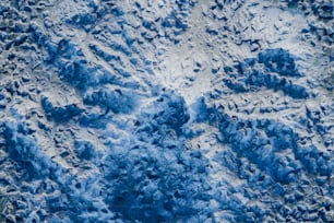 an aerial view of a snow covered mountain