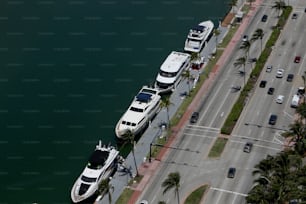 a couple of boats parked next to each other on the side of a road