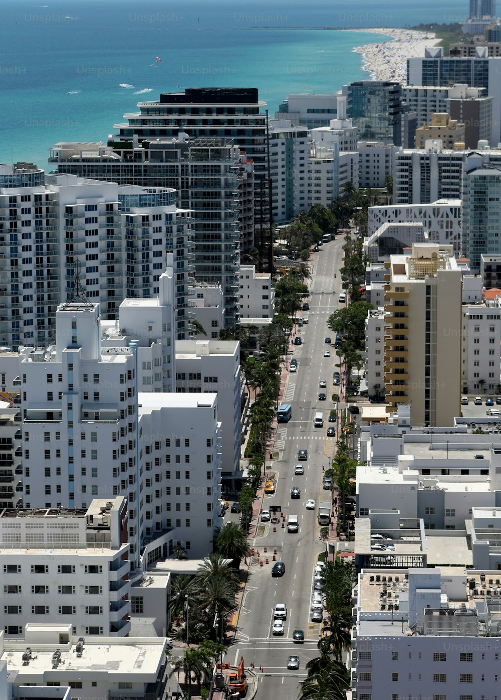 an aerial view of a city with tall buildings