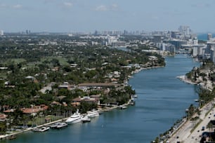 a river running through a city next to tall buildings