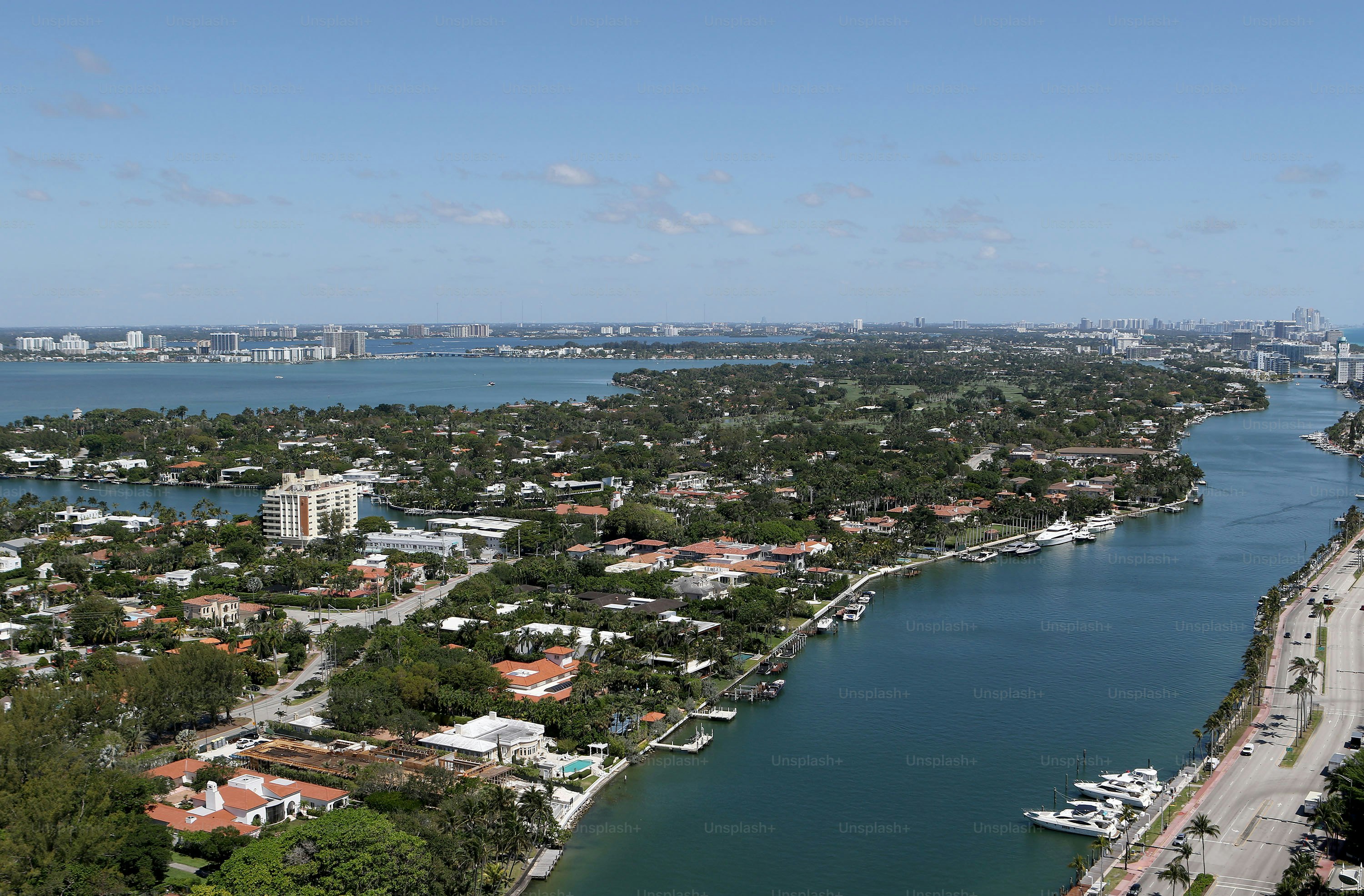 an aerial view of a city and a body of water
