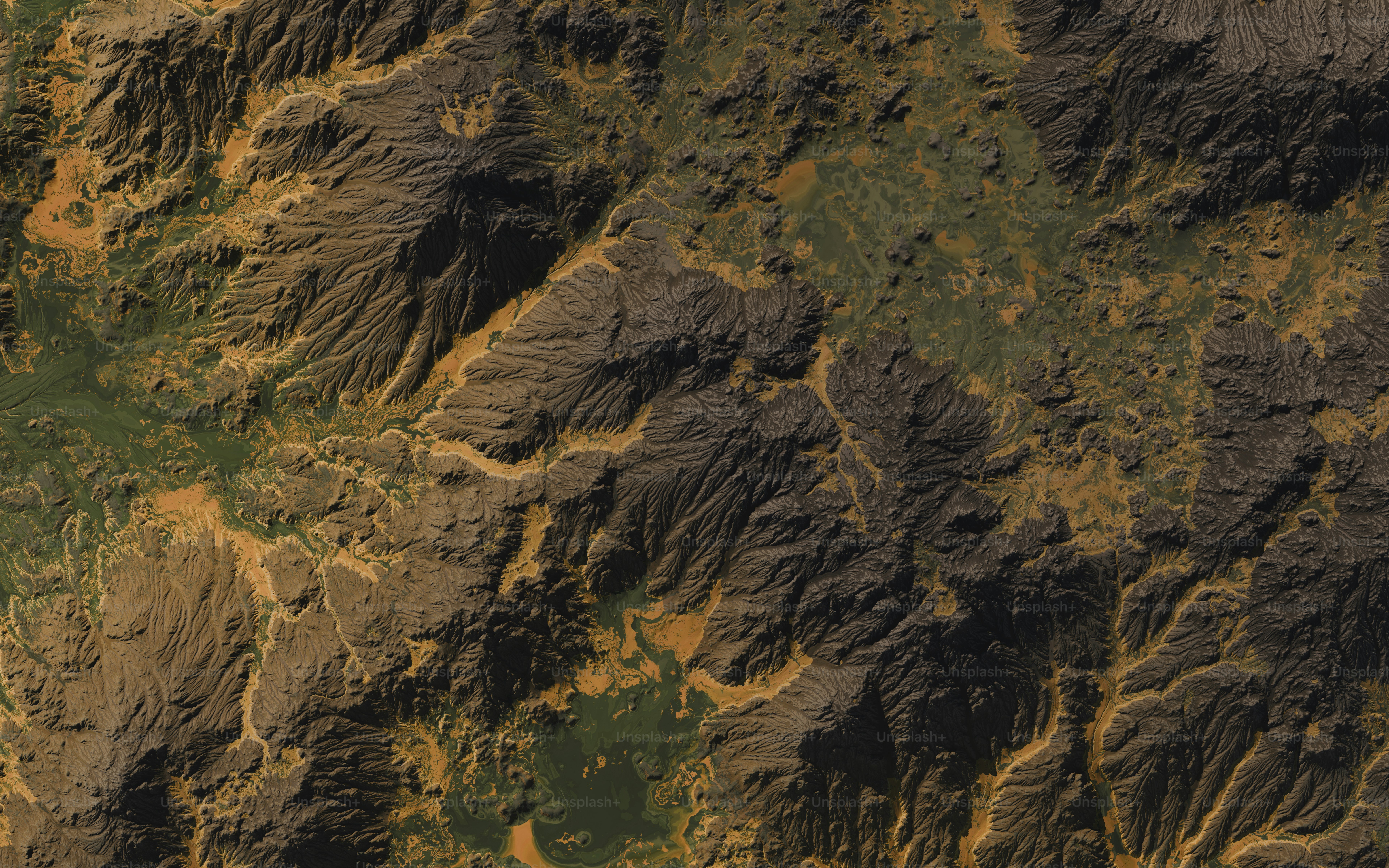 une vue aérienne d’une chaîne de montagnes survolée par un avion