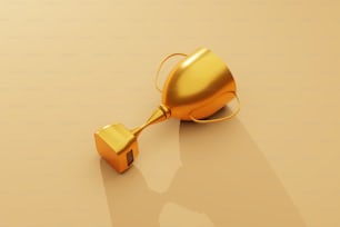 a golden object on a beige background