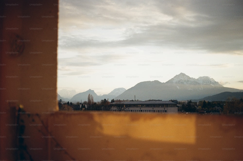 a view of a mountain range from a window