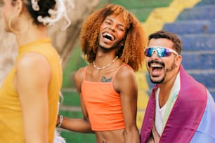 a man and a woman laughing and standing next to each other