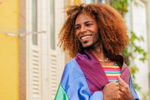 a man with curly hair wearing a colorful jacket