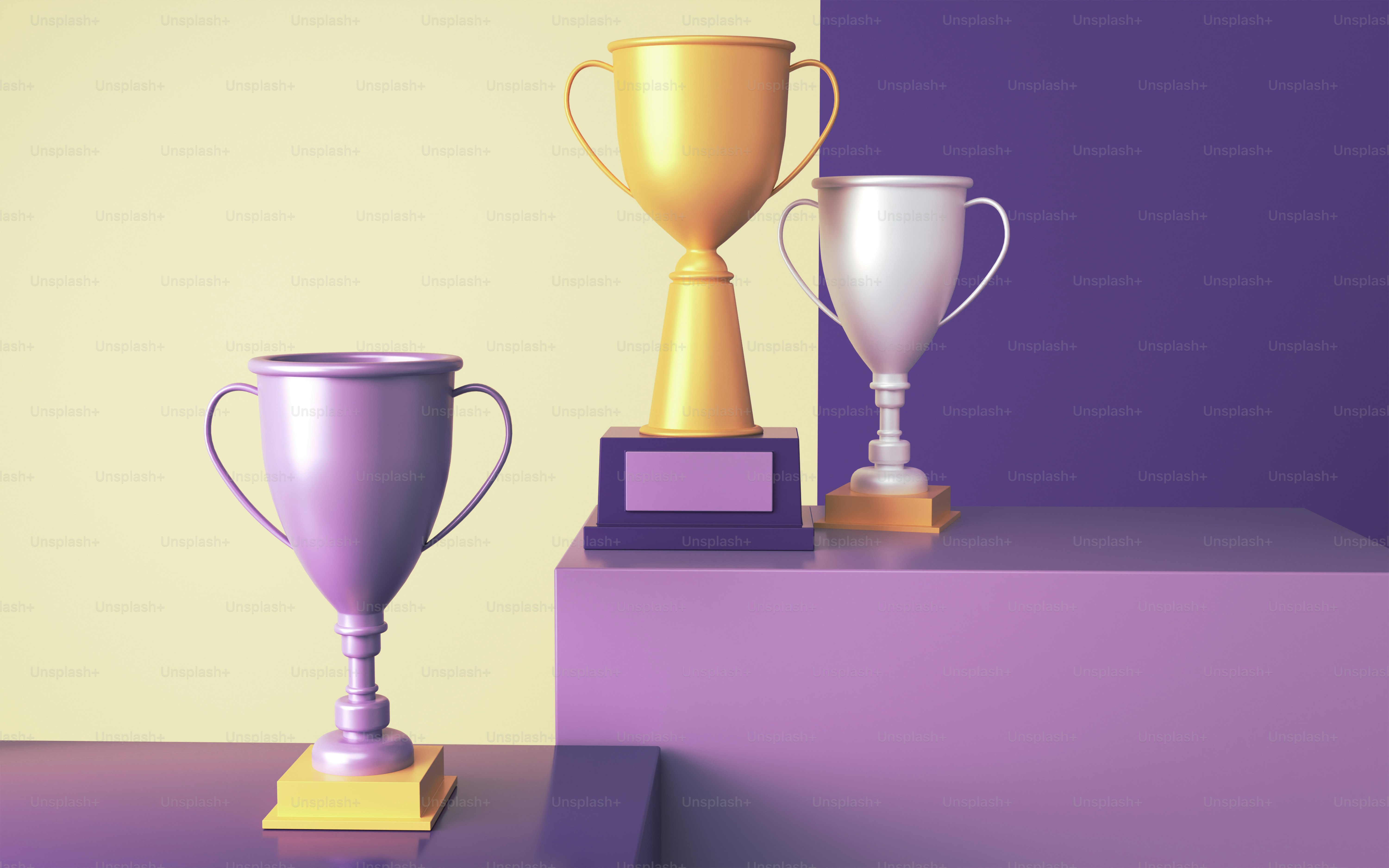 Three trophies on a tiered display