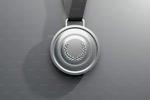 a silver medal with a black ribbon around it