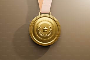 a gold medal with a pink ribbon around it