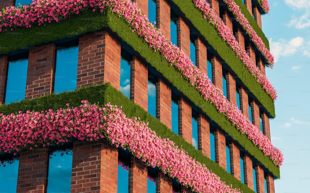 a building with pink flowers growing on the side of it