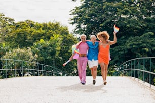 a group of women walking across a bridge