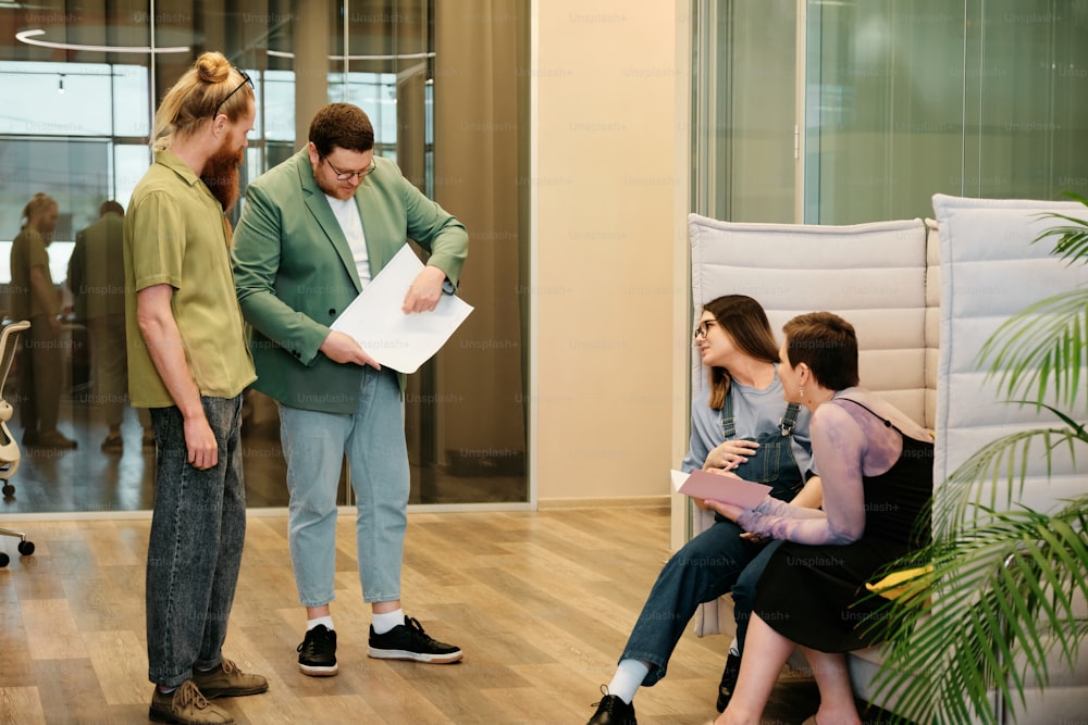 a group of people standing around a room