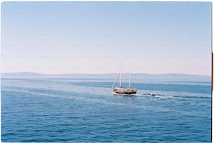 a sailboat sailing across a large body of water