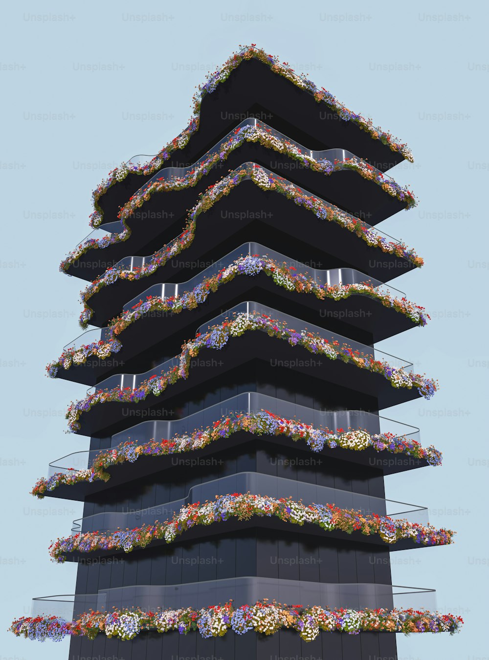 a tall tower with a bunch of flowers on it