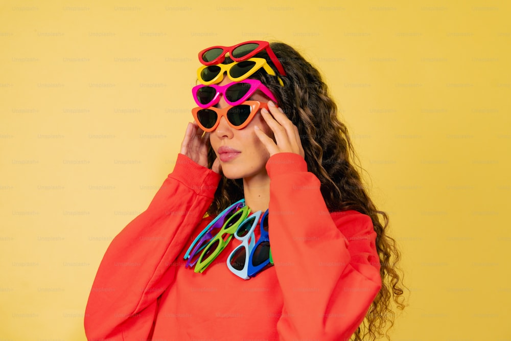 a woman in a red shirt and sunglasses