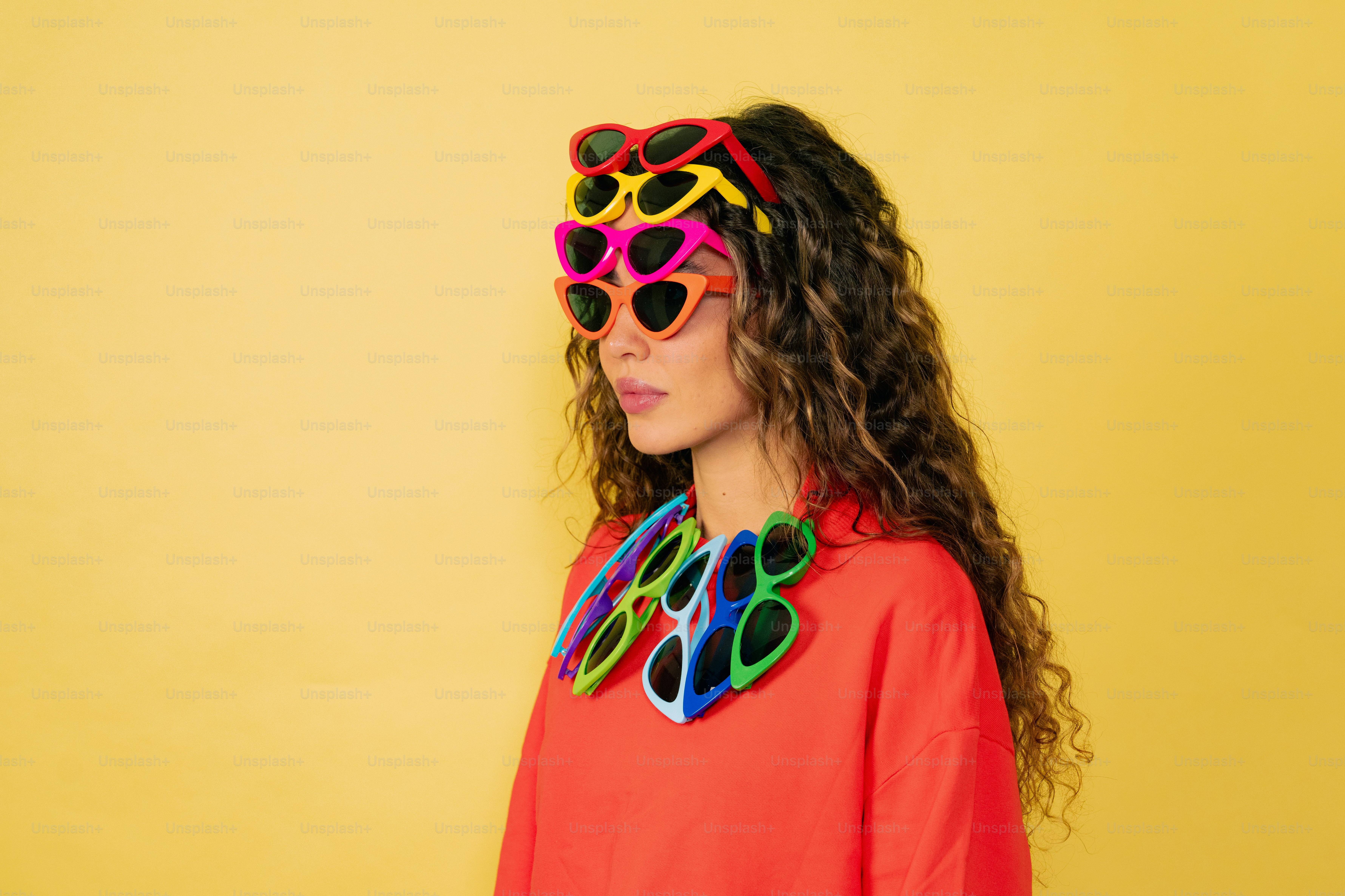 a woman wearing sunglasses and a red shirt