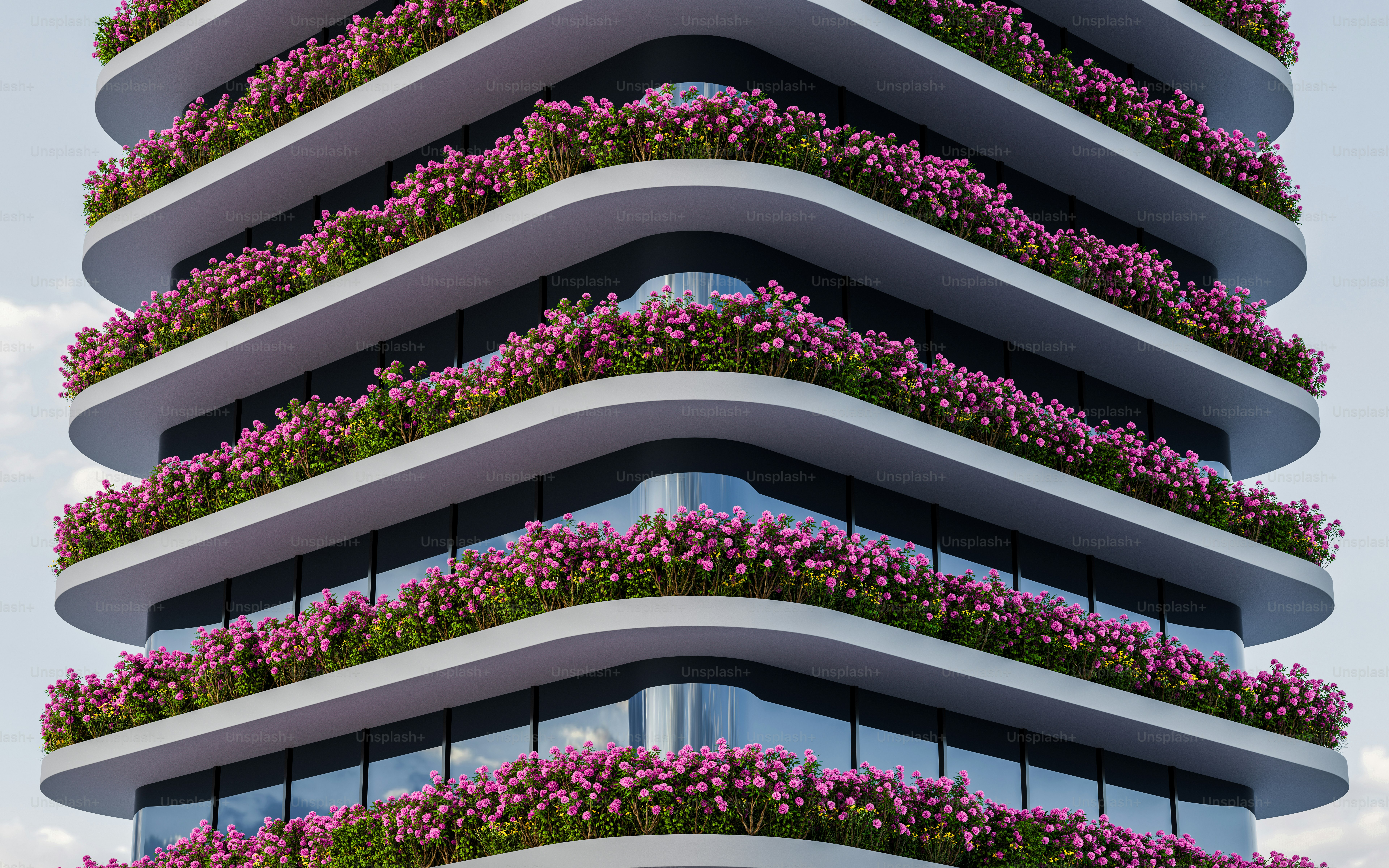 a tall building with a bunch of purple flowers on the balconies
