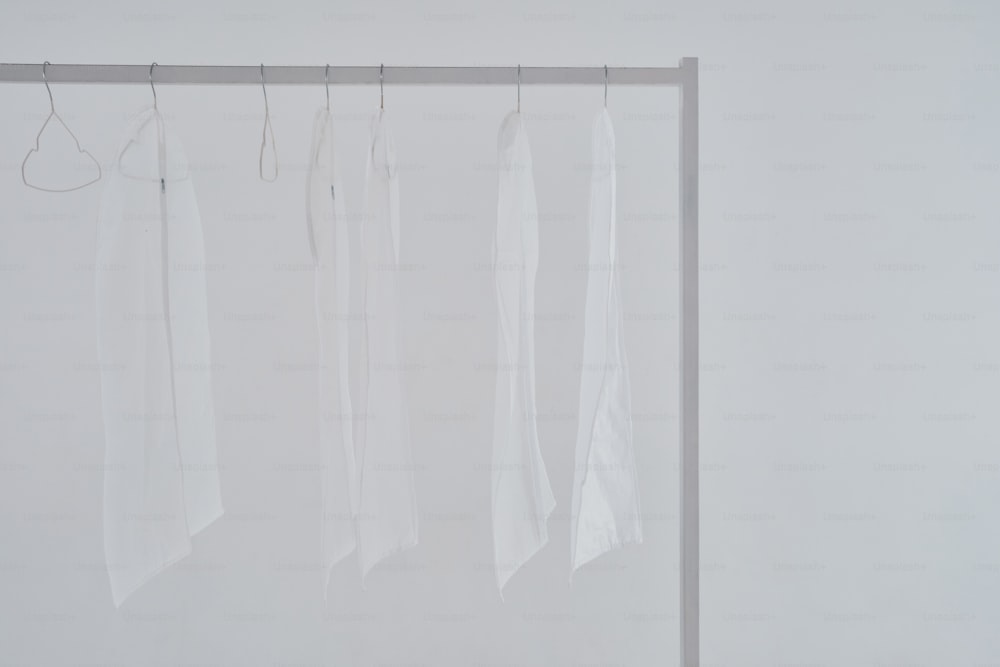 a group of clothes hanging on a clothes line