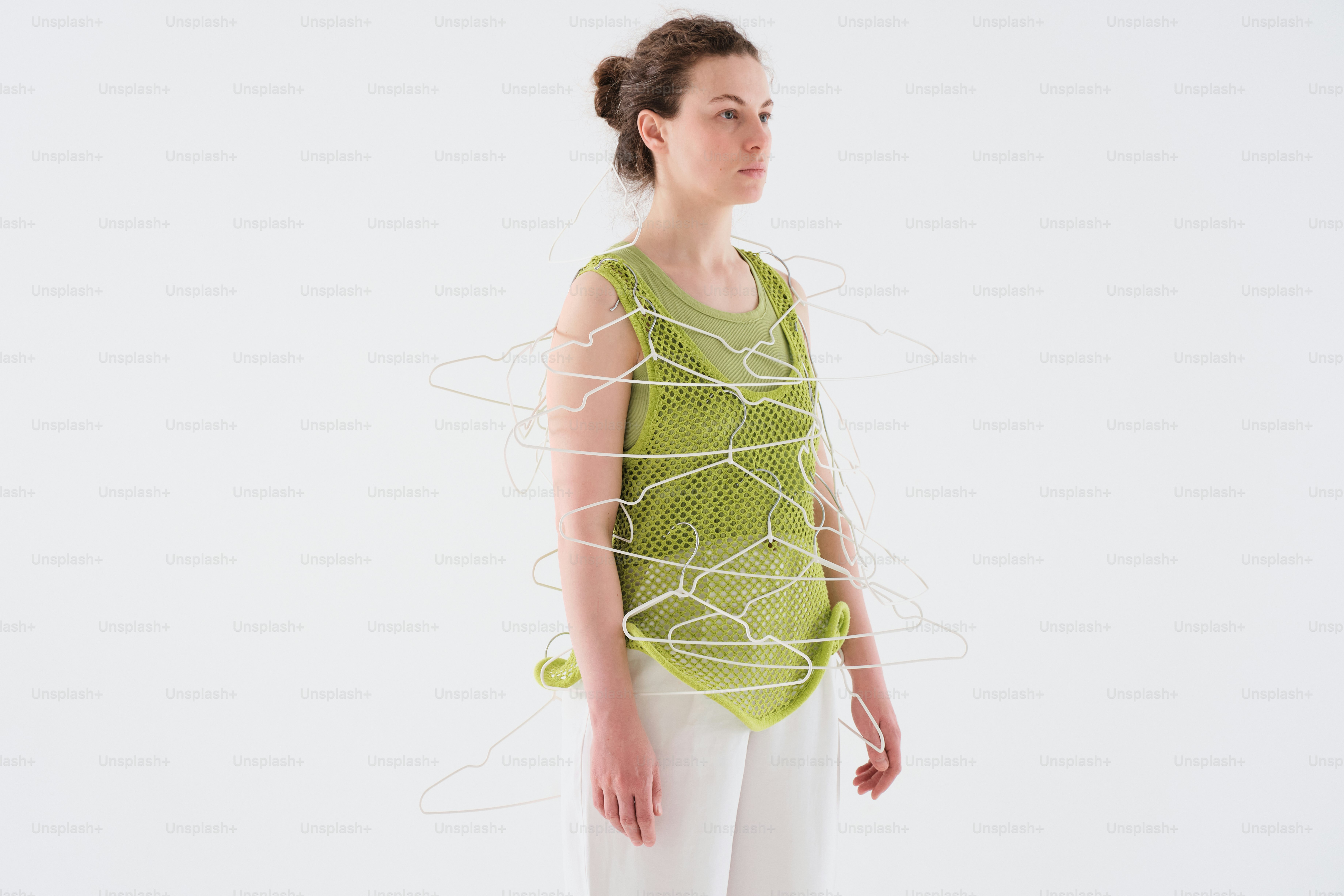 a woman standing in front of a white background