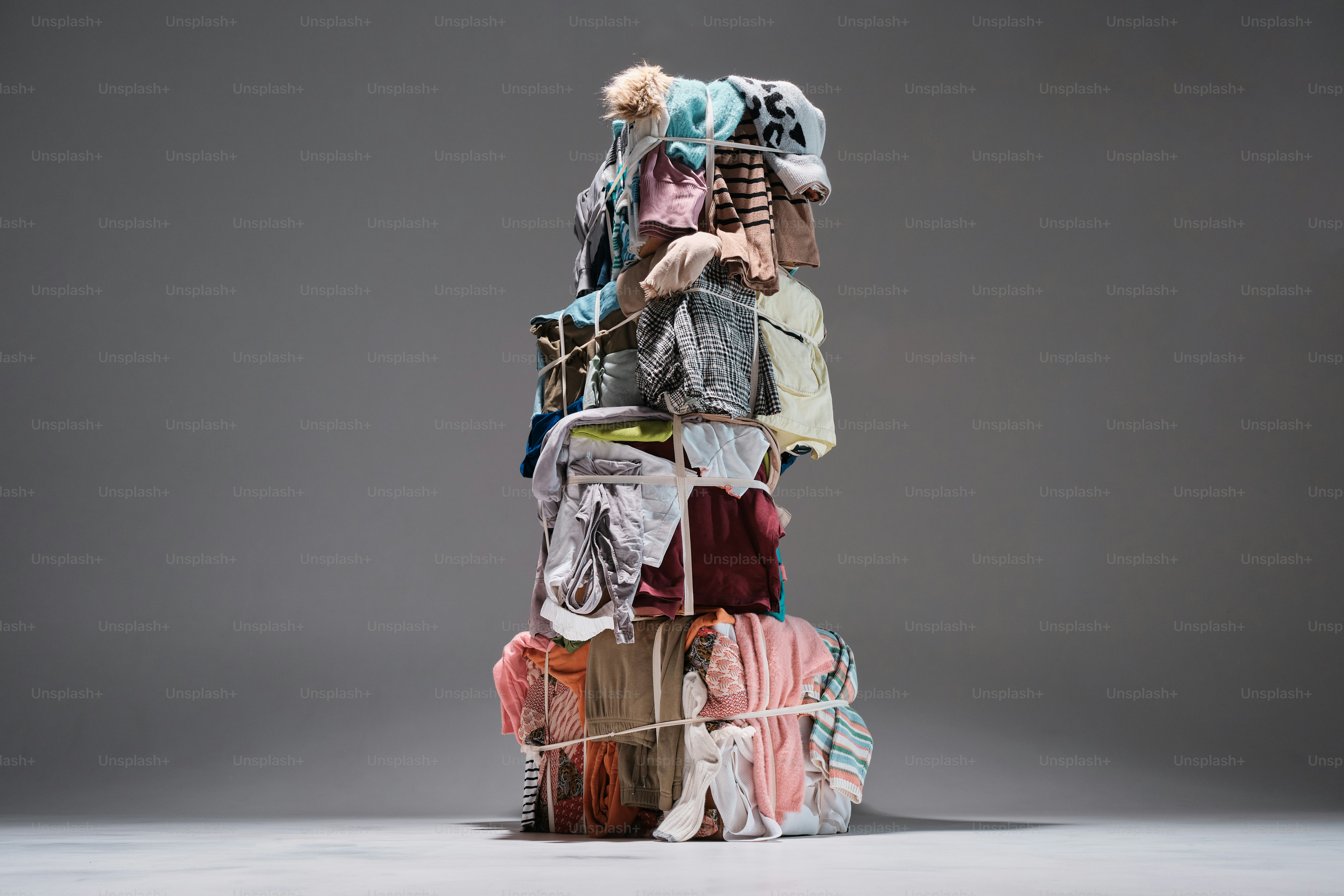 a pile of clothes sitting on top of each other