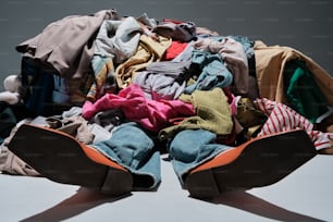 a pile of clothes sitting on top of a table