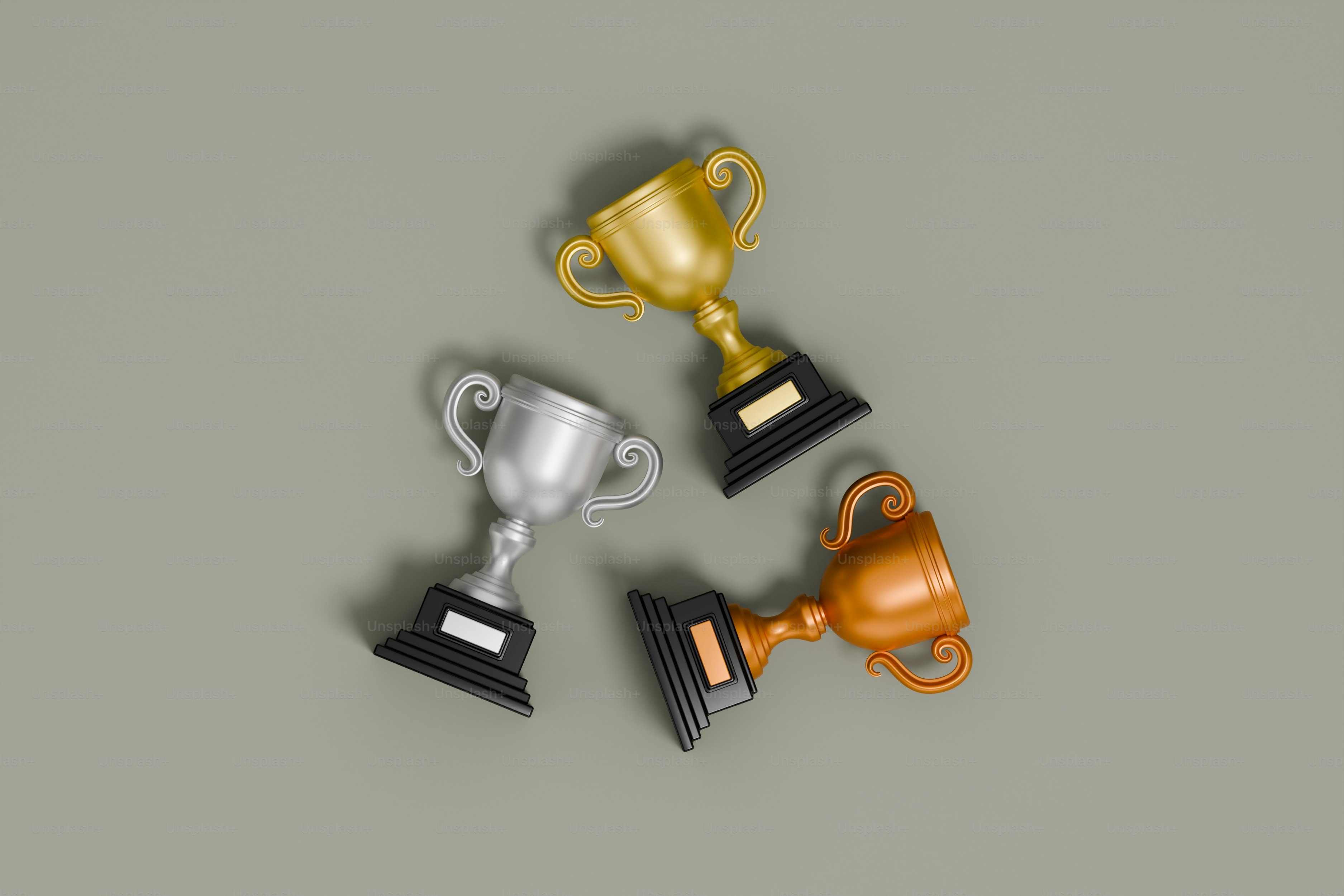 Gold, Silver, and Bronze Trophies. 3D Render.