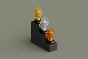 Un conjunto de tres trofeos colocados uno encima del otro