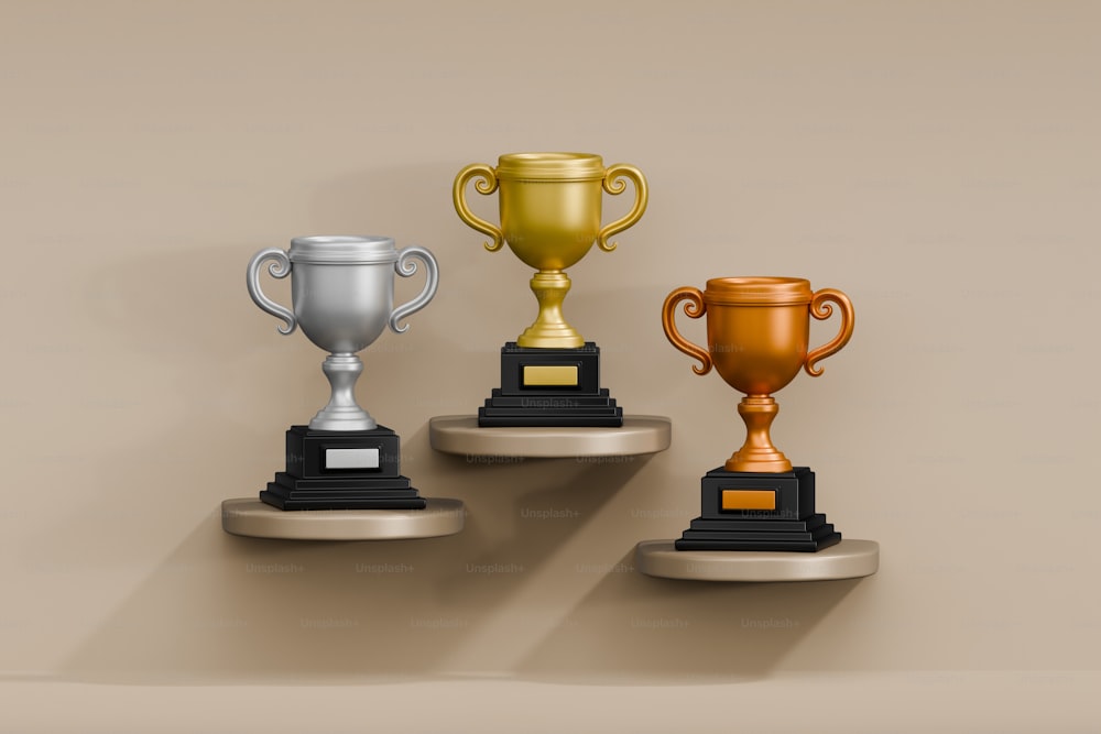 a row of three trophies sitting on top of each other