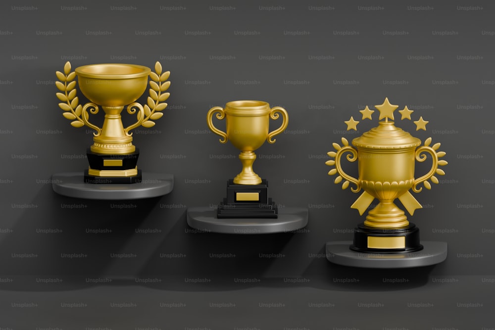 three trophies with stars on each of them