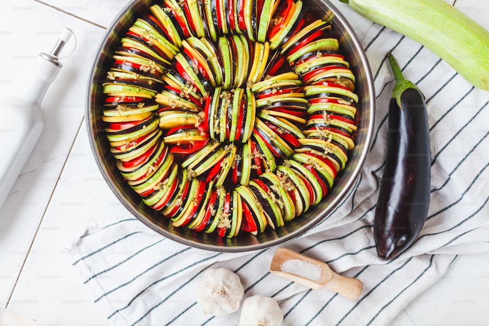 a pan filled with vegetables on top of a table