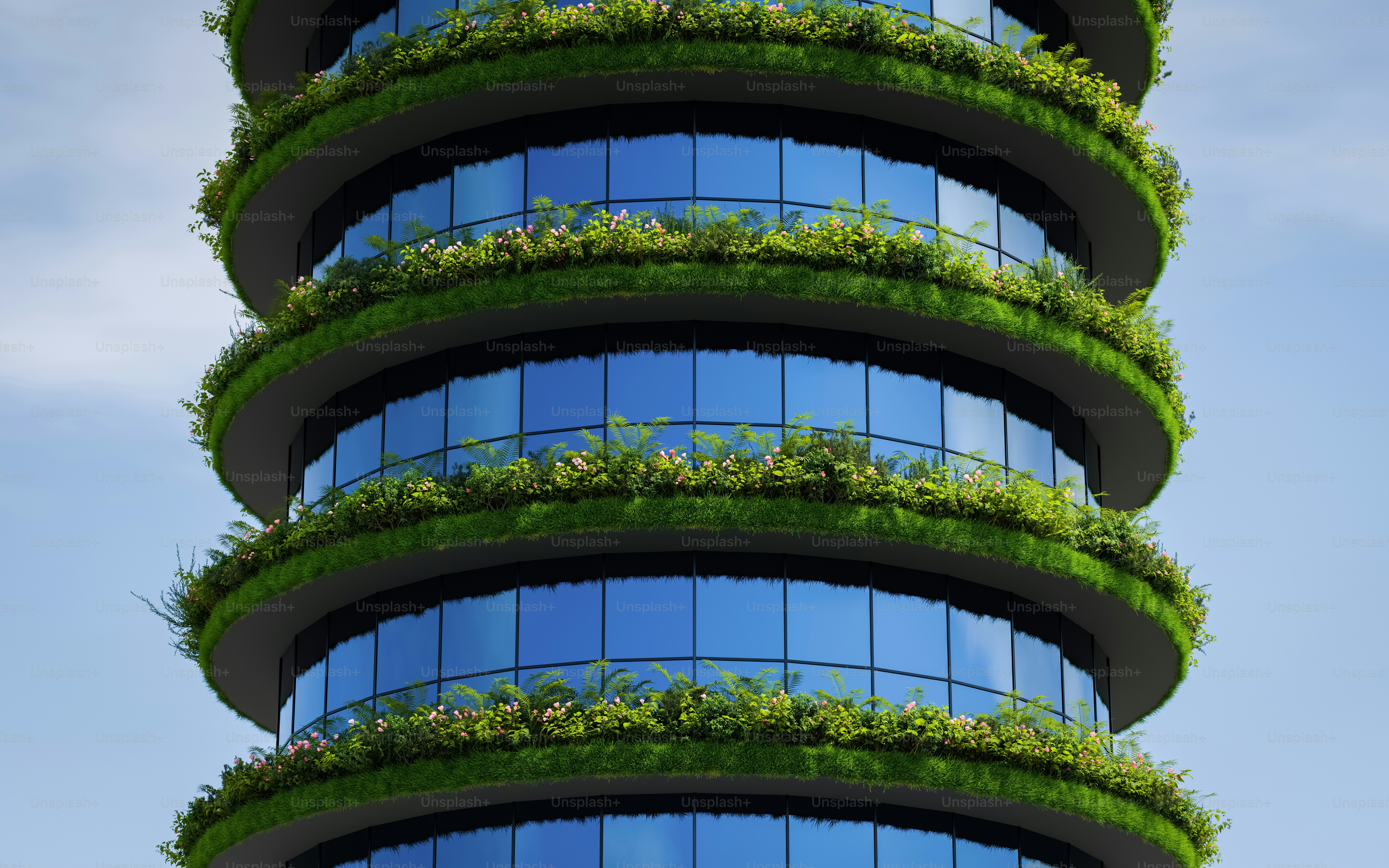 a very tall building with a bunch of plants growing on it